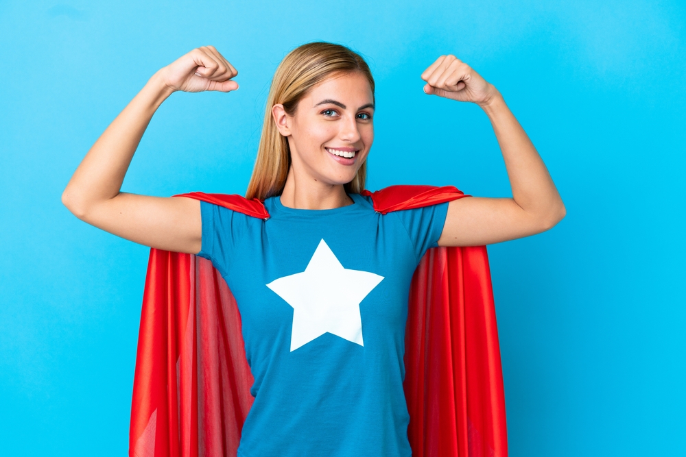 Strong, arrogant woman dressed in a super hero costume