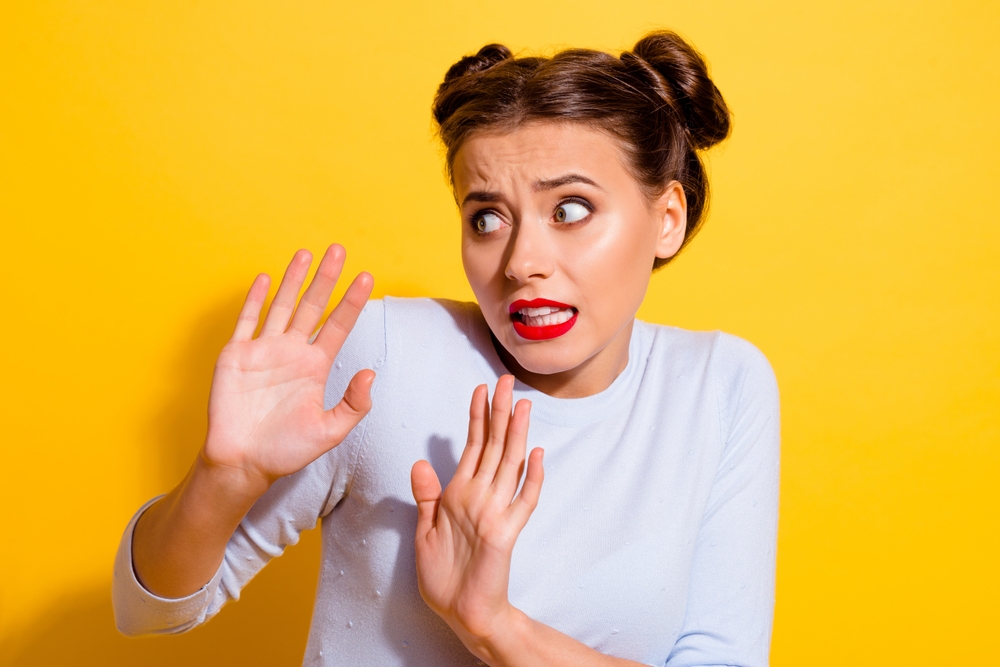A young woman looking scared.