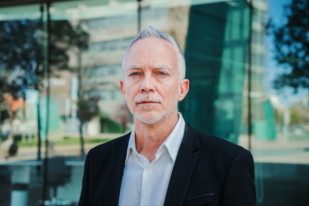 A mature man in suit at work