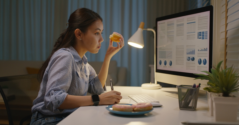 A busy young woman working alone