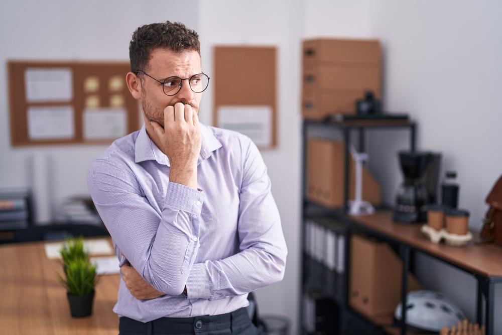 Young Man at the Office Looking Stressed and Nervous