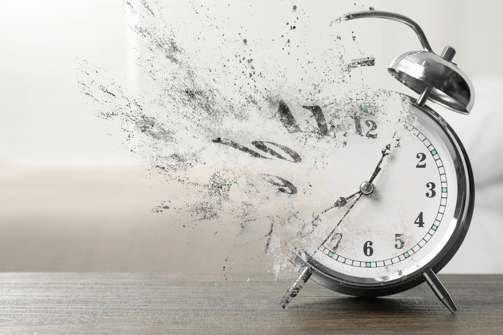 An alarm clock dissolving its numbers.