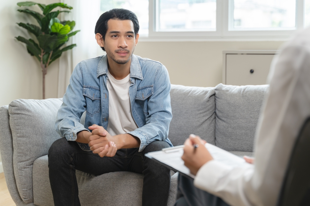 A young man in a therapist's office.