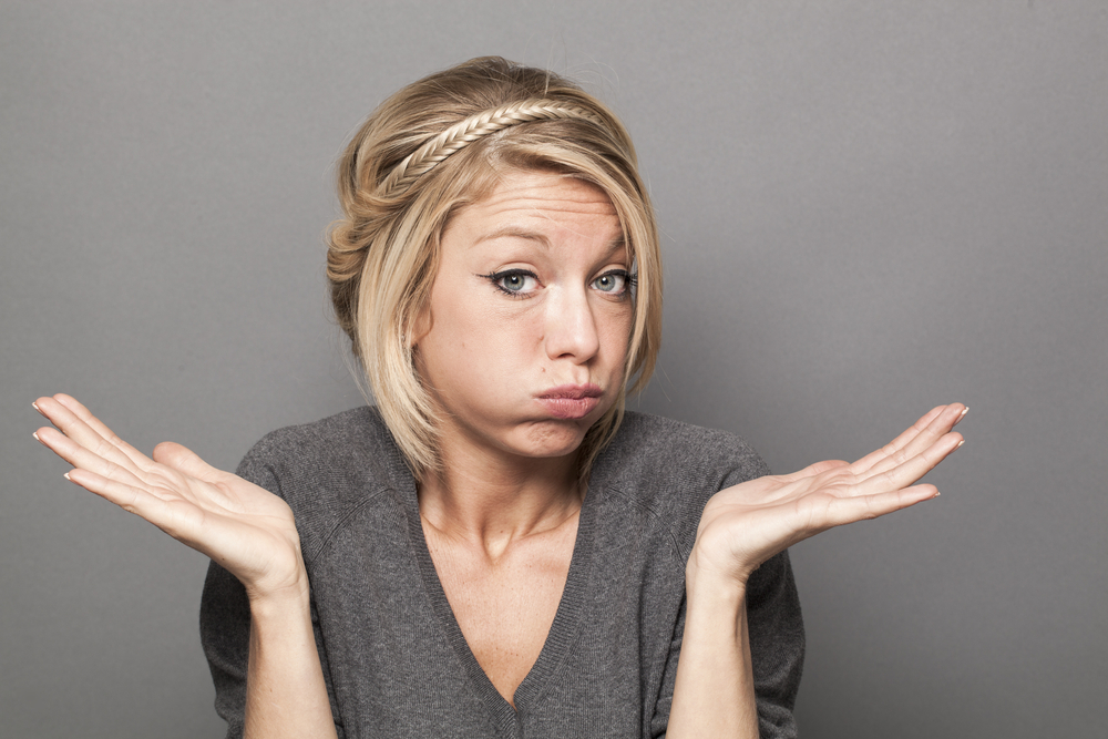 A Gen Z woman shrugging her shoulders.