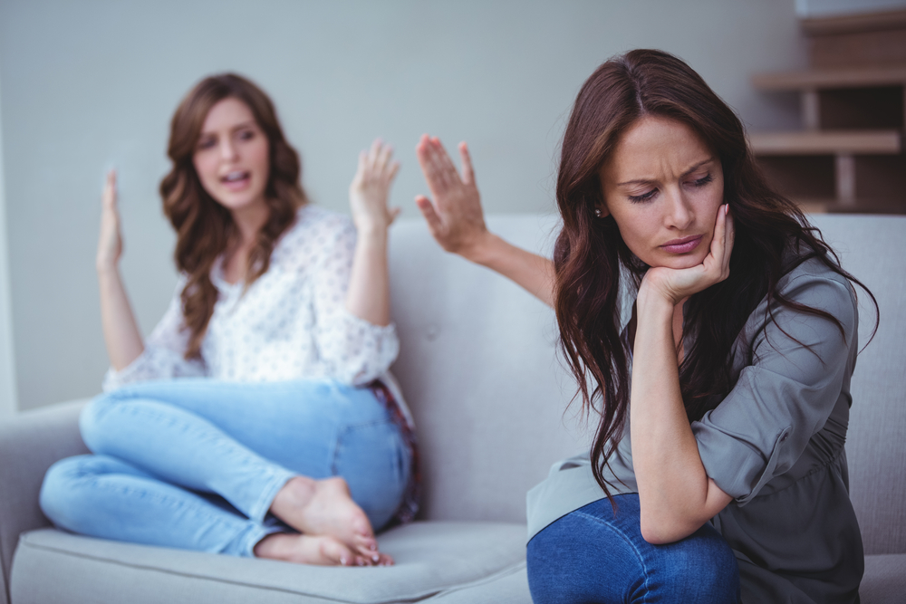 Two women have a stressful conversation or argument