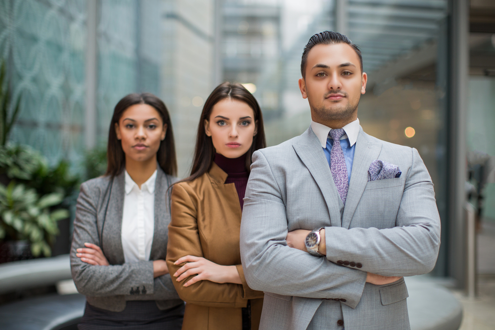 Colleagues outside of their office.