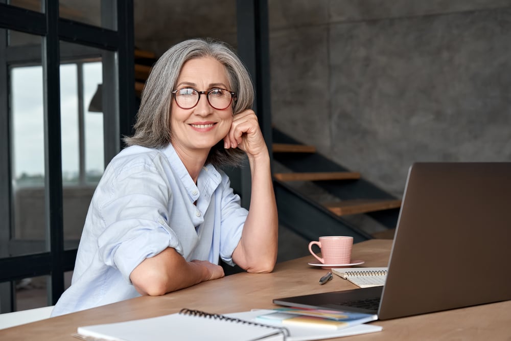 A smiling, stylish mature middle age successful business woman