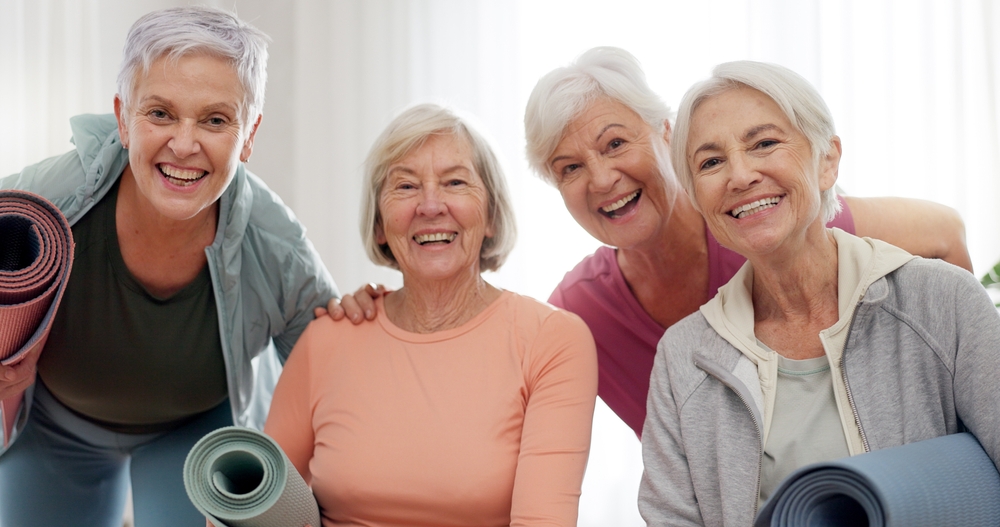 A group of senior friends in the same yoga class