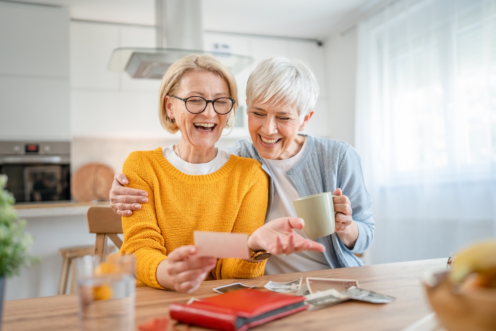 Senior mature women looking at photos and photo albums