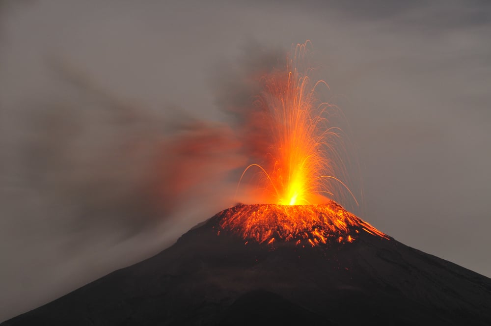 An active volcano erupting.