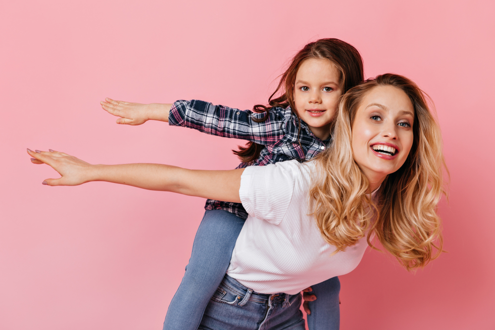 Mother and daughter playing together.