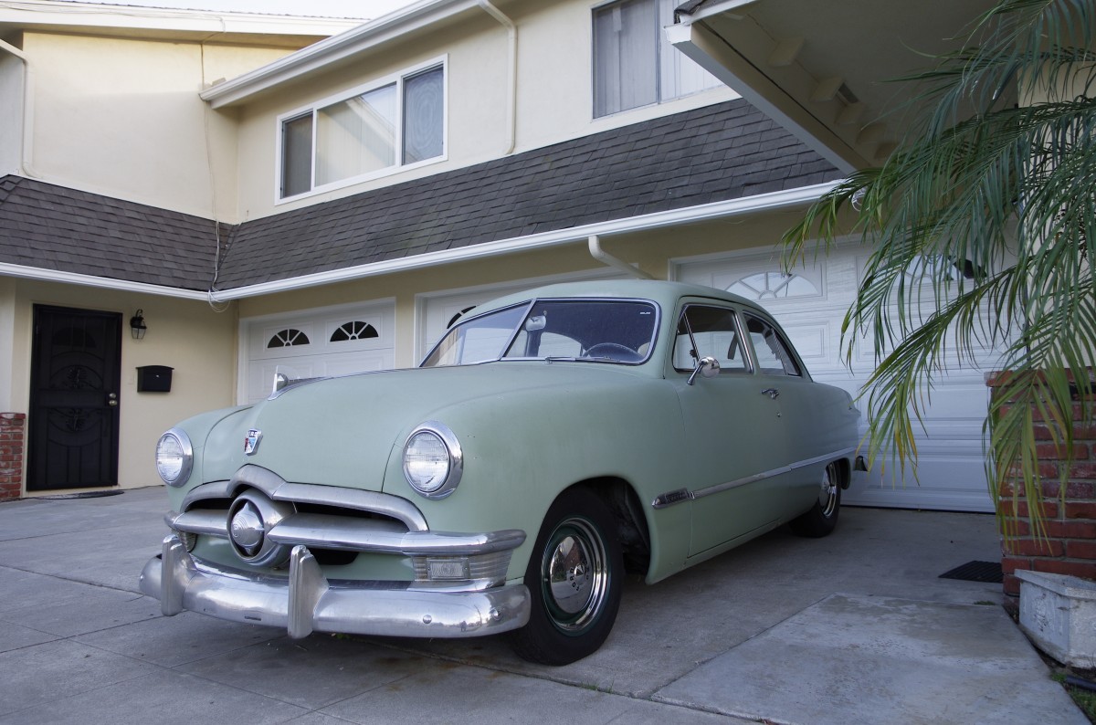 Classic car in driveway.
