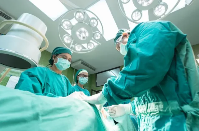 team of doctors-performing surgery in operating room