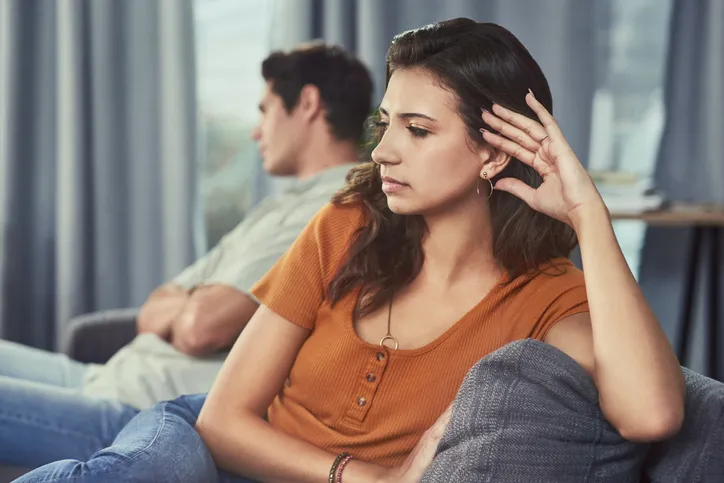 couple arguing looking upset