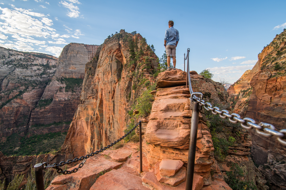 A white male tourist standing with confidence