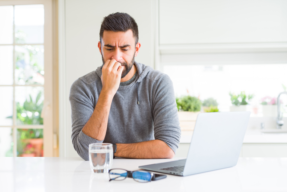 Man reading on his computer.