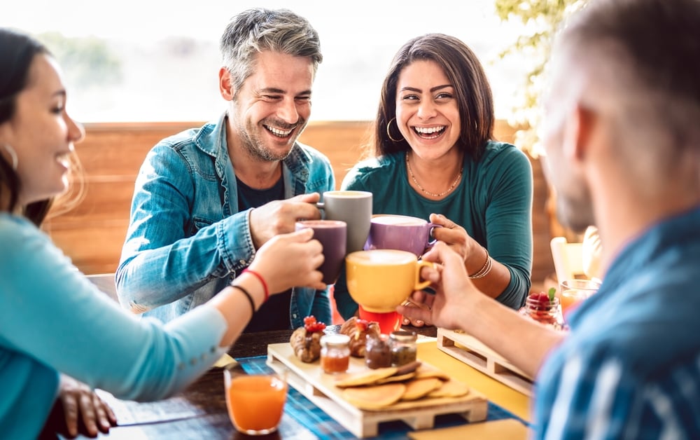 A group of friends having a drink and toasting