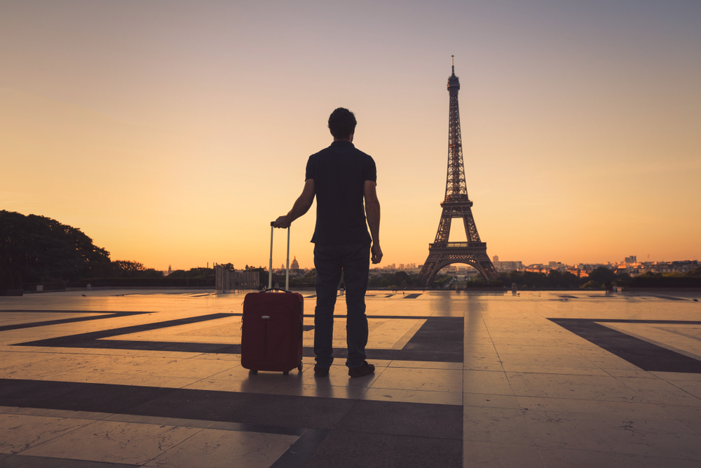 Traveller in Paris, France with Eiffel Tower.
