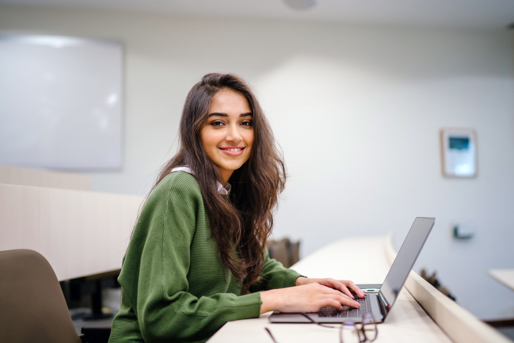 A Gen Z woman at her computer.
