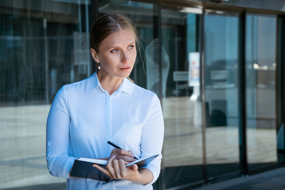 business woman writes in notebook