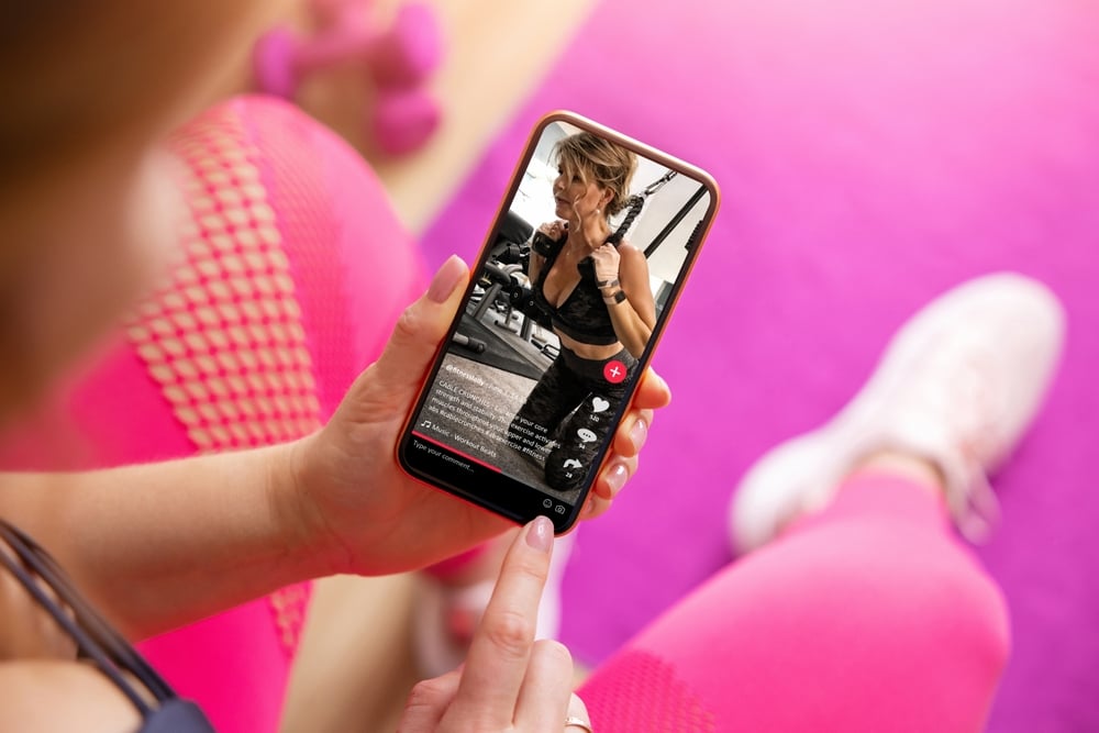 Woman watching videos on her smartphone.