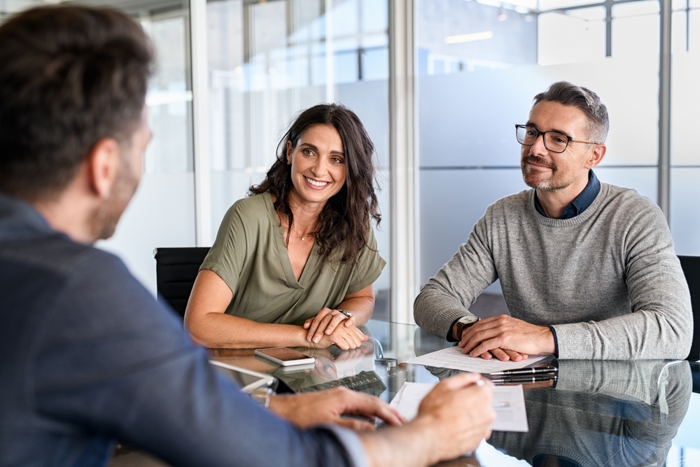 Couple sitting with an expert advisor or therapist