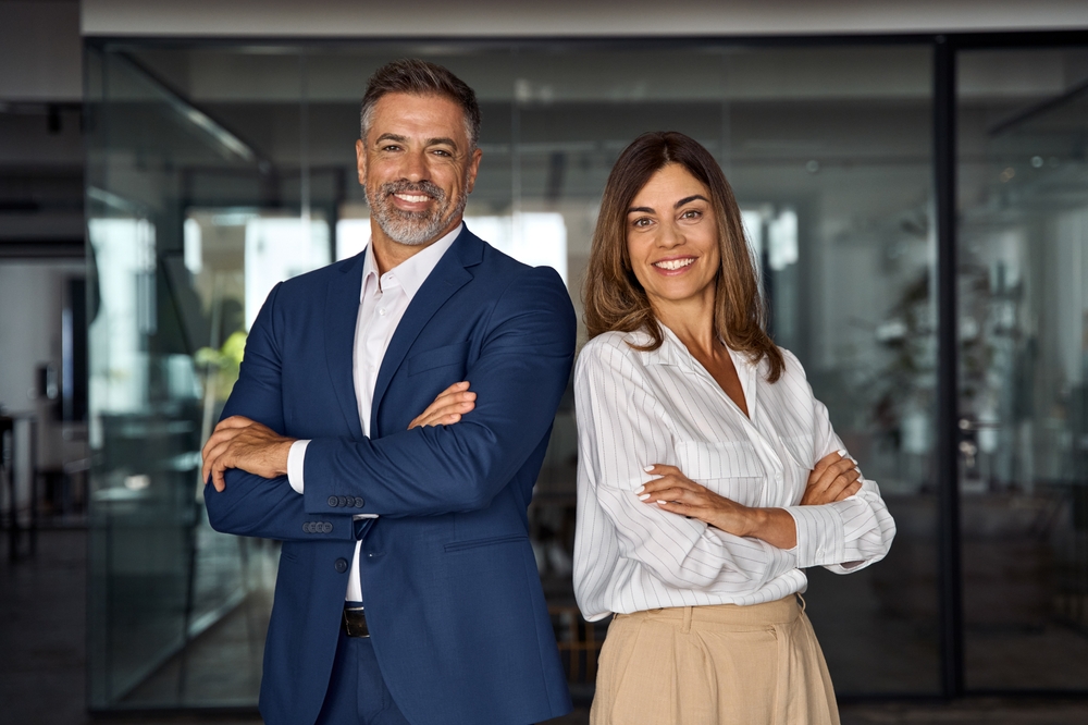 A smiling mature middle age business man and woman