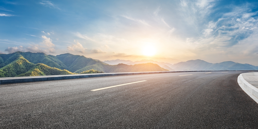 A highway and setting sun.