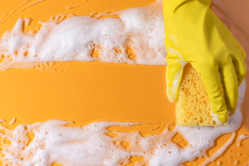 Cleaning with rubber gloves.