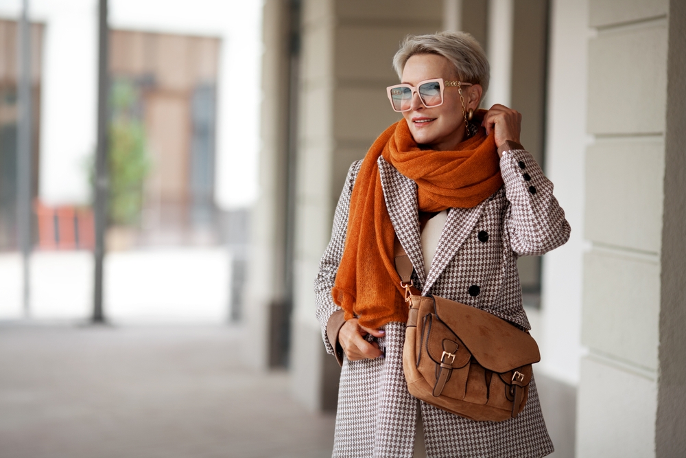A smiling mature woman walking outdoors