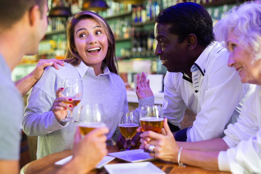A group having drinks and a conversation