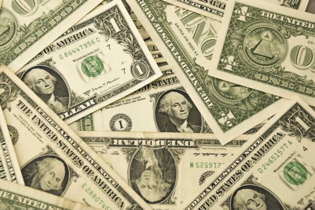 Pile of American one-dollar bills.