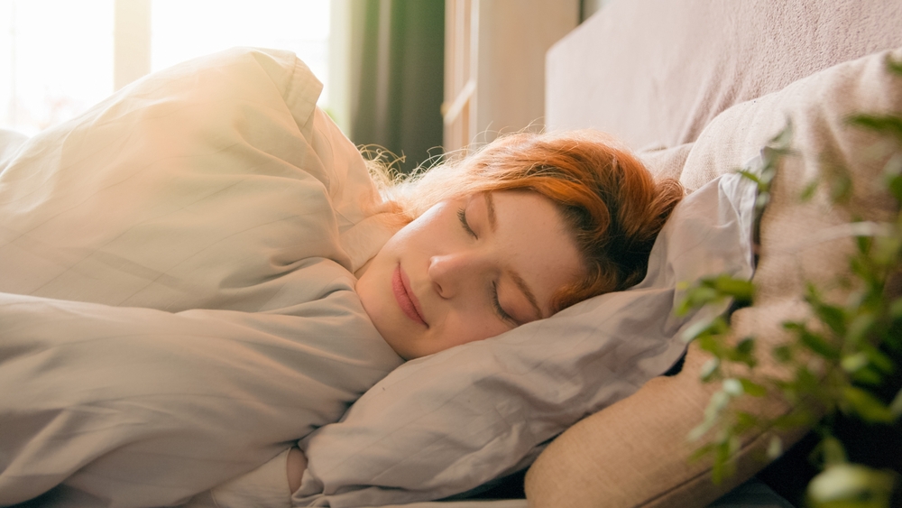 Woman asleep in bed.