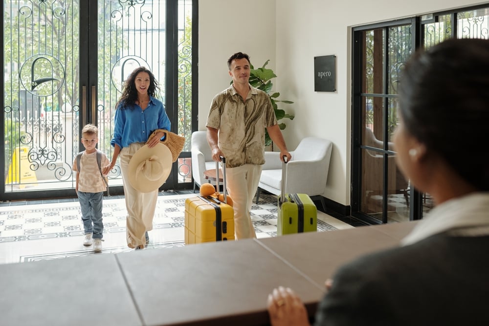 A family checking into a hotel
